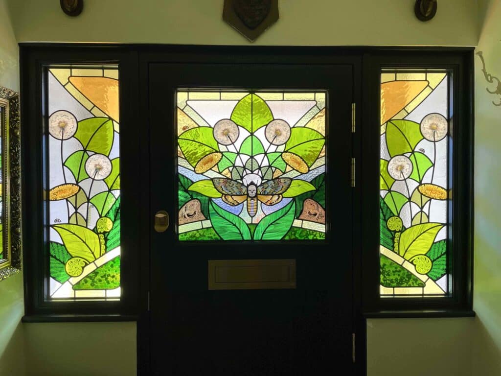 Death Head Hawk Moth front door and side lights. Lead light and painting on glass.